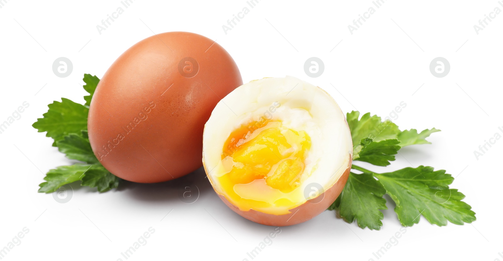Soft boiled eggs and parsley on white background Photo of Soft boiled eggs and parsley on white background