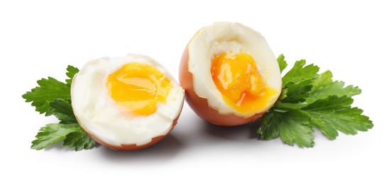 Photo of Soft boiled egg and parsley on white background