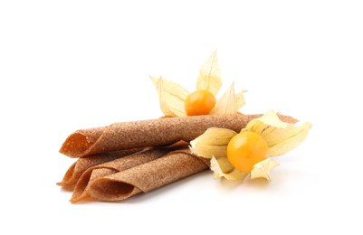 Photo of Tasty fruit leather rolls and physalis isolated on white
