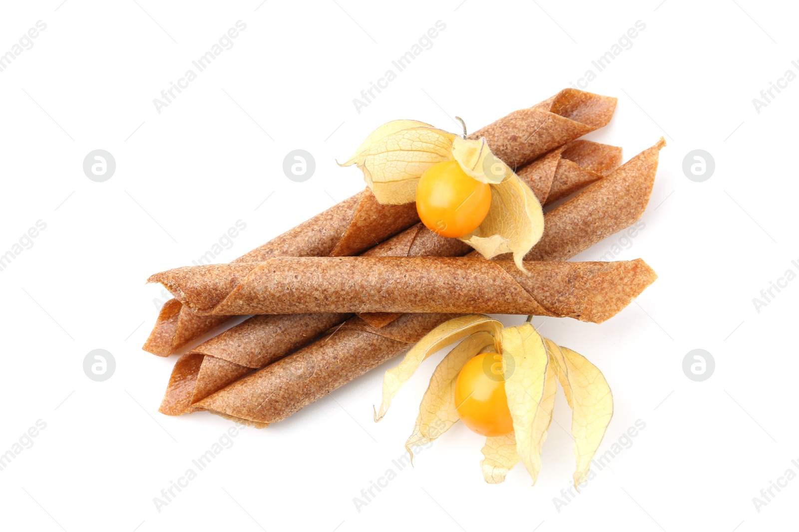 Tasty fruit leather rolls and physalis isolated on white, top view Photo of Tasty fruit leather rolls and physalis isolated on white, top view
