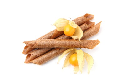 Photo of Tasty fruit leather rolls and physalis isolated on white, top view