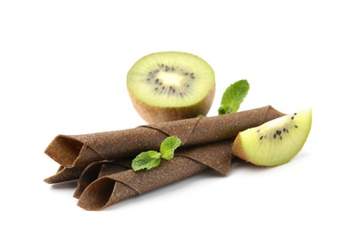 Photo of Tasty fruit leather rolls, kiwi and mint isolated on white