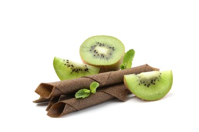 Photo of Tasty fruit leather rolls, kiwi and mint isolated on white