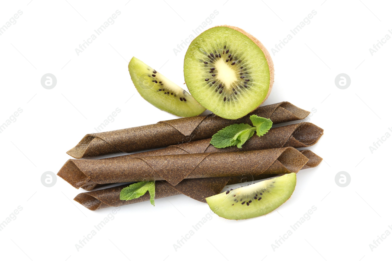 Tasty fruit leather rolls, kiwi and mint isolated on white, top view Photo of Tasty fruit leather rolls, kiwi and mint isolated on white, top view
