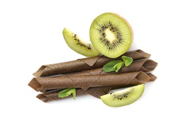 Photo of Tasty fruit leather rolls, kiwi and mint isolated on white, top view