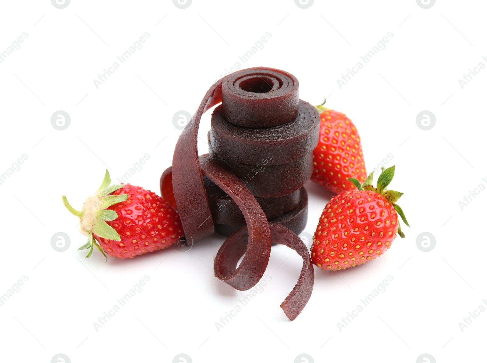 Tasty fruit leather rolls and strawberries isolated on white Photo of Tasty fruit leather rolls and strawberries isolated on white