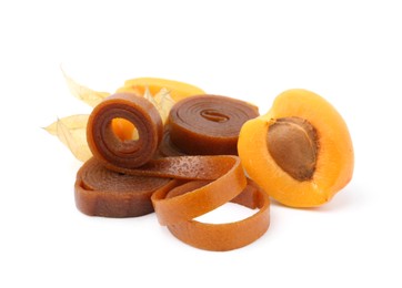 Photo of Tasty fruit leather, apricot and physalis isolated on white