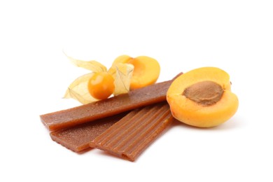 Photo of Tasty fruit leather, apricot and physalis isolated on white