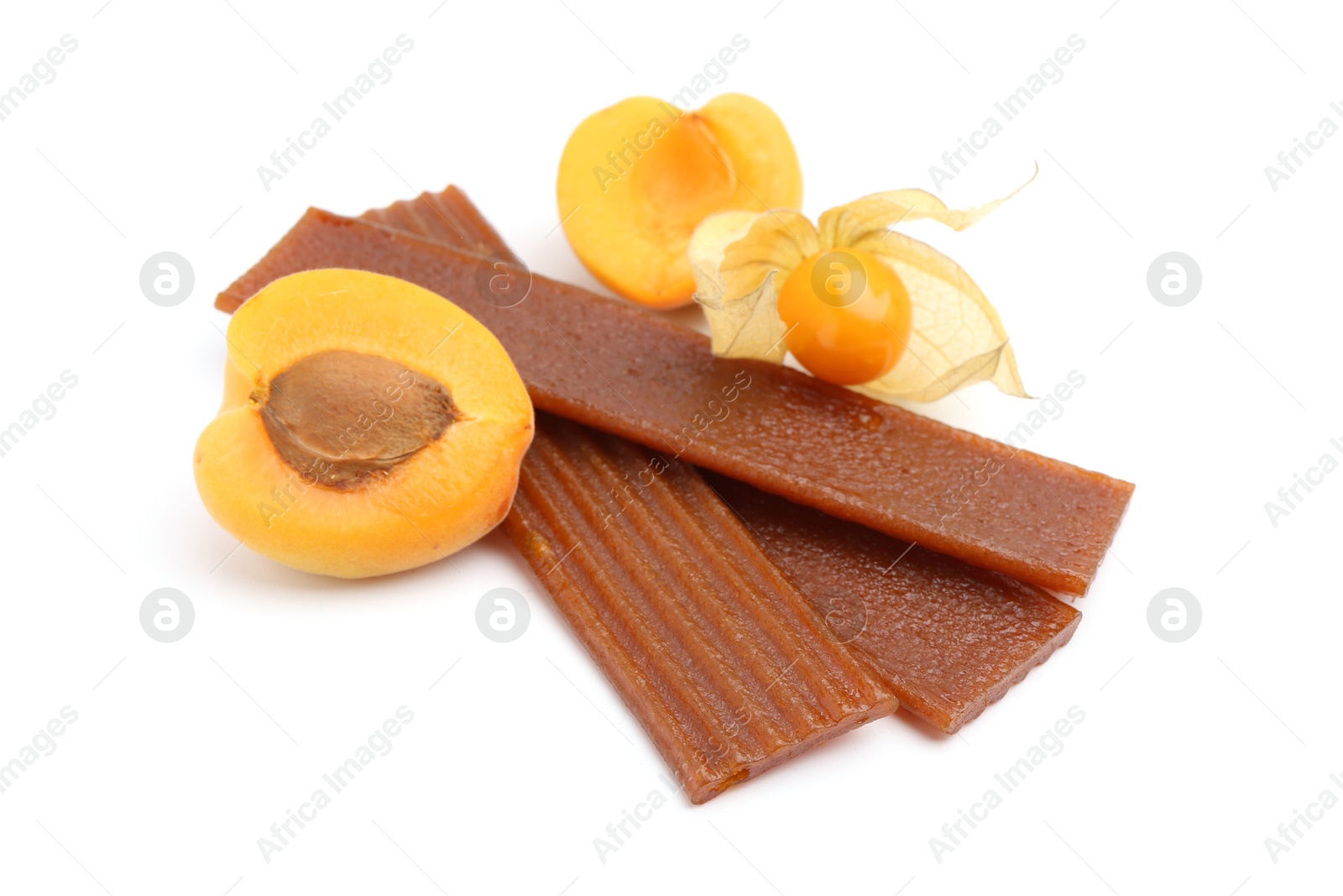 Tasty fruit leather, apricot and physalis isolated on white Photo of Tasty fruit leather, apricot and physalis isolated on white
