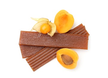 Photo of Tasty fruit leather, apricot and physalis isolated on white, top view