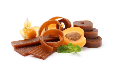 Photo of Tasty fruit leather, apricot and physalis isolated on white