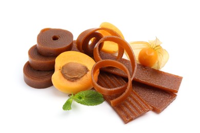 Photo of Tasty fruit leather, apricot and physalis isolated on white