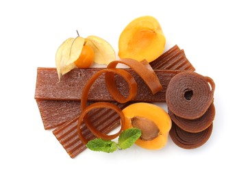 Photo of Tasty fruit leather, apricot and physalis isolated on white, top view