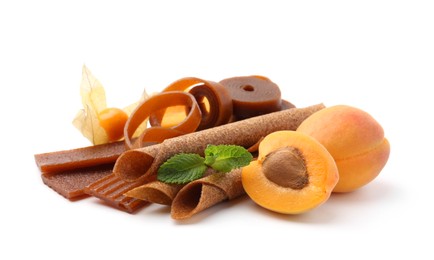Photo of Tasty fruit leather, apricots and physalis isolated on white