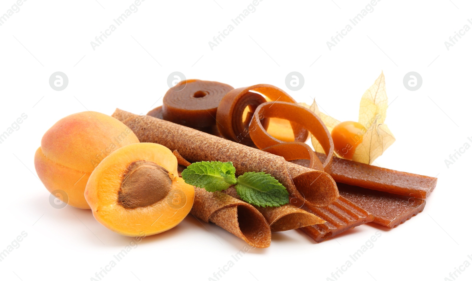 Tasty fruit leather, apricots and physalis isolated on white Photo of Tasty fruit leather, apricots and physalis isolated on white