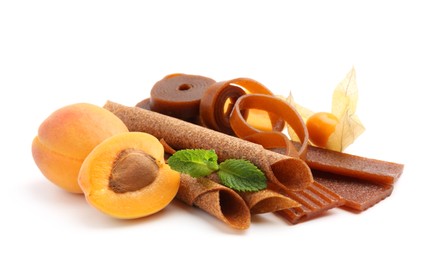 Photo of Tasty fruit leather, apricots and physalis isolated on white