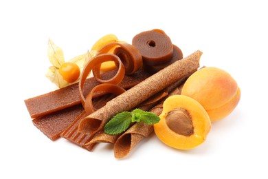 Photo of Tasty fruit leather, apricots and physalis isolated on white