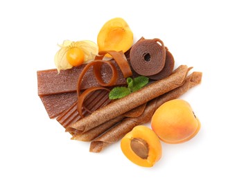 Photo of Tasty fruit leather, apricots and physalis isolated on white, top view