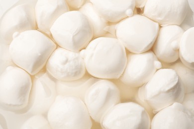 Photo of Tasty mozzarella cheese balls as background, closeup