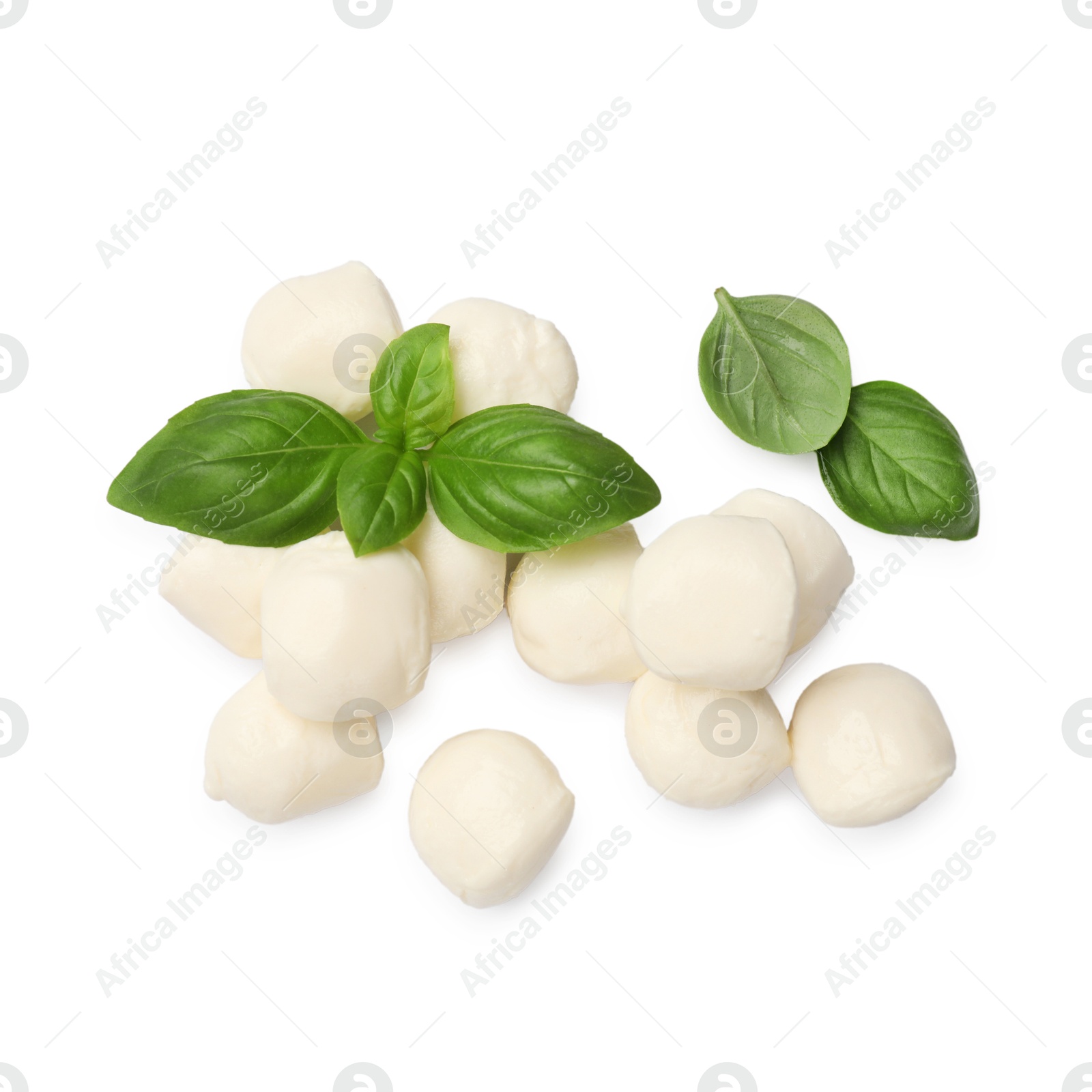 Tasty mozzarella cheese balls and basil isolated on white, top view Photo of Tasty mozzarella cheese balls and basil isolated on white, top view