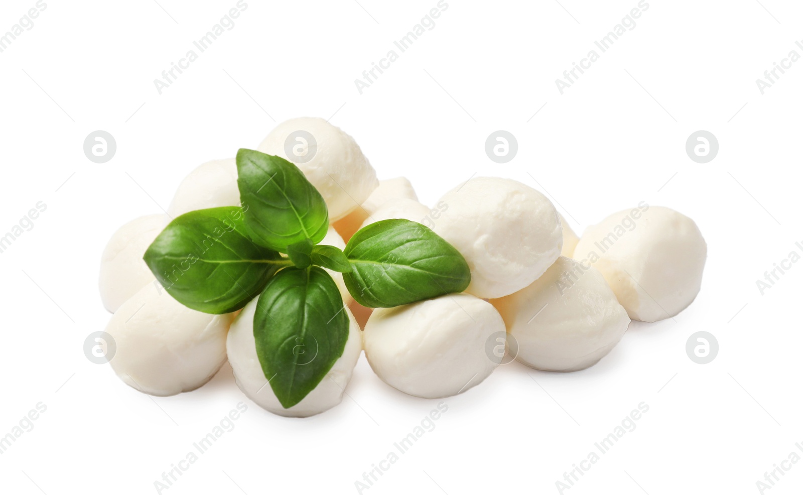 Tasty mozzarella cheese balls and basil isolated on white Photo of Tasty mozzarella cheese balls and basil isolated on white