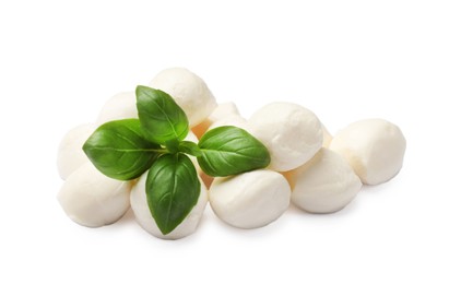 Photo of Tasty mozzarella cheese balls and basil isolated on white