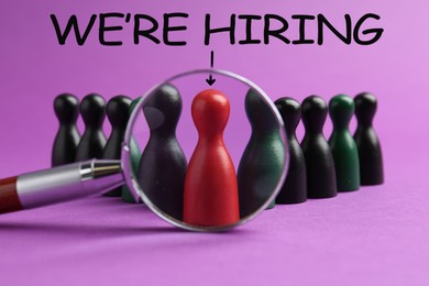 Image of We Are Hiring. Red figure among black ones on violet background, view through magnifying glass. Recruitment, human resources concept