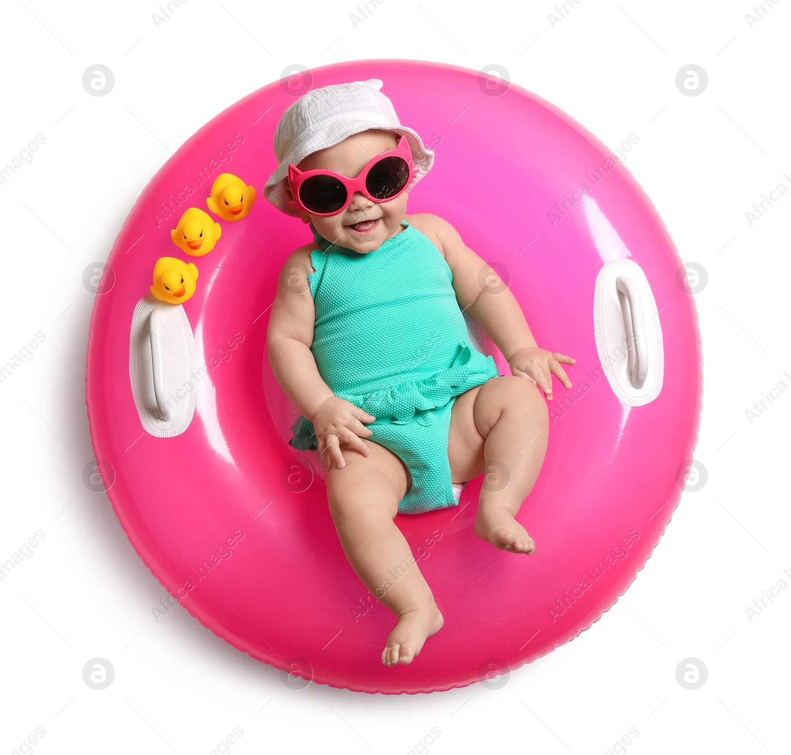 Cute little baby in sunglasses with inflatable ring on white background, top view Photo of Cute little baby in sunglasses with inflatable ring on white background, top view