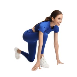 Photo of Runner in starting position on white background