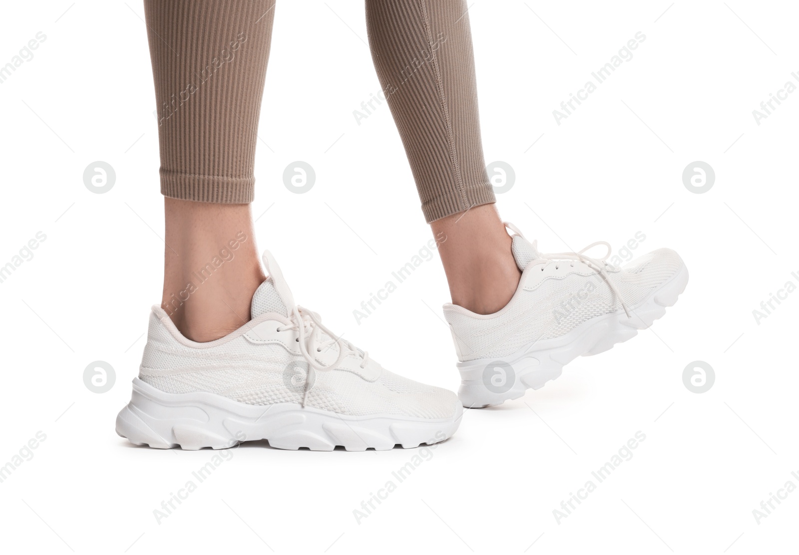 Runner in starting position on white background, closeup Photo of Runner in starting position on white background, closeup