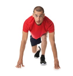 Photo of Runner in starting position on white background