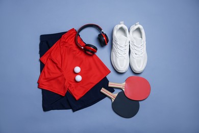 Photo of Flat lay composition with sportswear on grey background