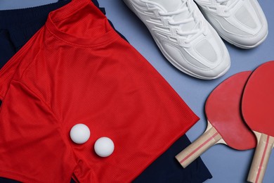 Photo of Flat lay composition with sportswear on grey background