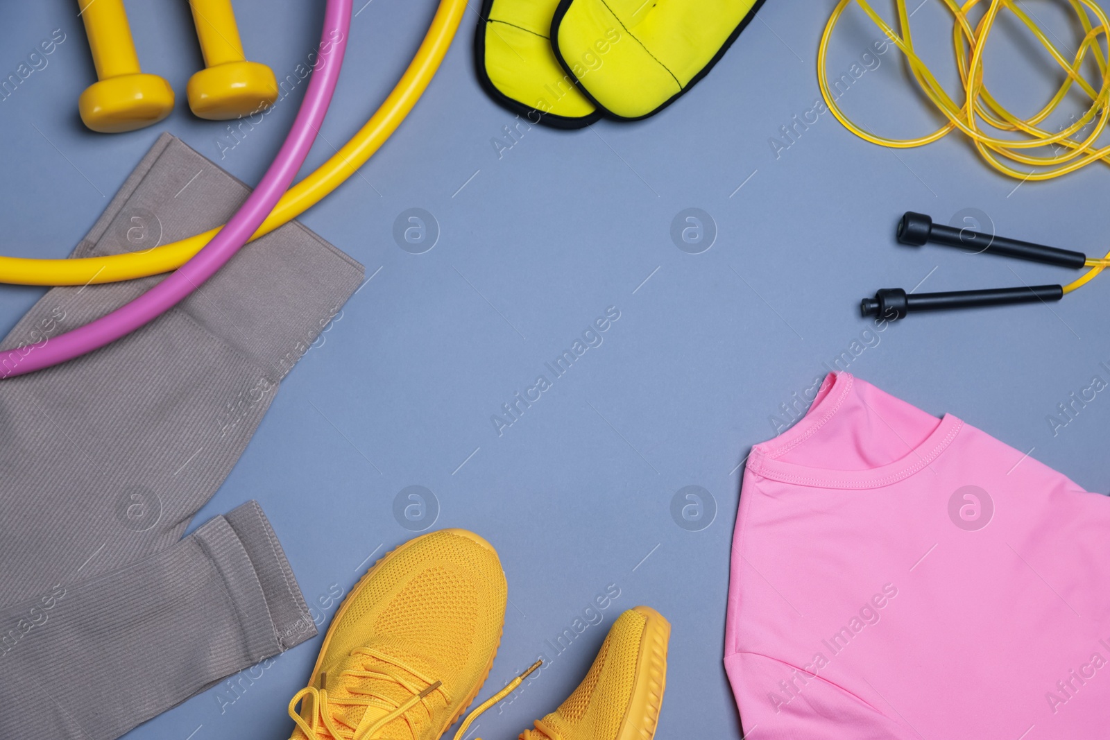Flat lay composition with sportswear on grey background, space for text Photo of Flat lay composition with sportswear on grey background, space for text