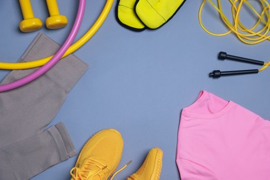 Photo of Flat lay composition with sportswear on grey background, space for text