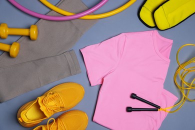 Photo of Flat lay composition with sportswear on grey background