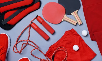 Photo of Flat lay composition with sportswear on grey background
