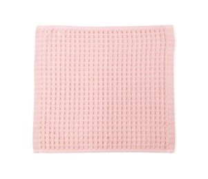 Photo of Clean pink waffle towel isolated on white, top view
