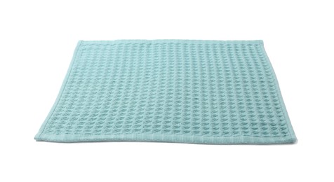 Photo of Clean light blue waffle towel isolated on white