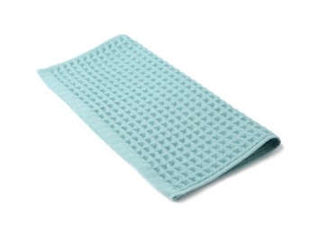 Photo of Clean light blue waffle towel isolated on white