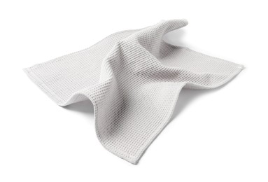 Photo of Clean light grey waffle towel isolated on white
