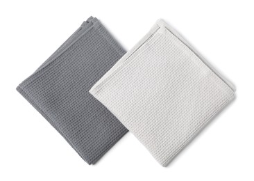 Photo of Two clean waffle towels isolated on white, top view