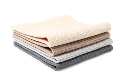 Photo of Many clean waffle towels isolated on white