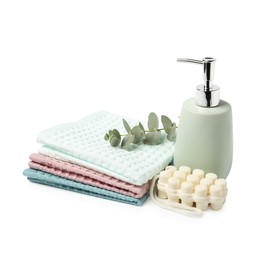 Photo of Clean waffle towels, soap and eucalyptus isolated on white