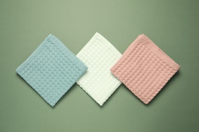 Photo of Clean waffle towels on green background, flat lay