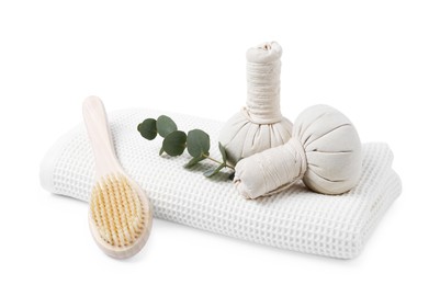 Photo of Clean waffle towel, massage bags, brush and eucalyptus isolated on white