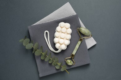Photo of Clean waffle towels and cosmetic products on grey background, flat lay