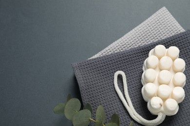 Photo of Clean waffle towels and cosmetic products on grey background, flat lay. Space for text