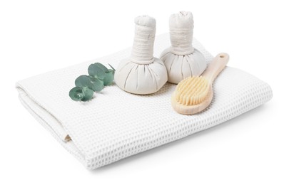 Photo of Clean waffle towel, massage bags, brush and eucalyptus isolated on white