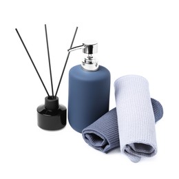 Photo of Clean waffle towels, soap and reed aroma diffuser isolated on white